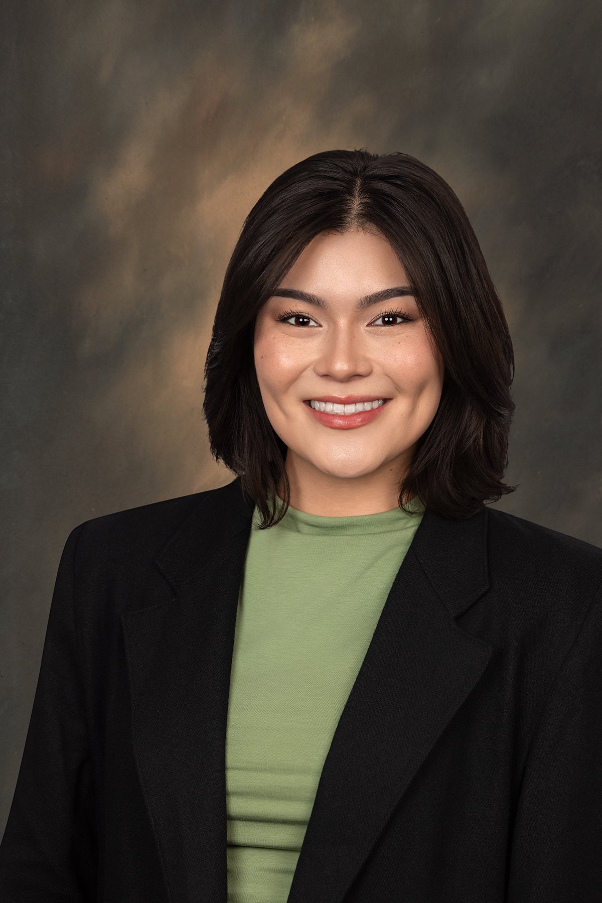 Professional business headshot smiling